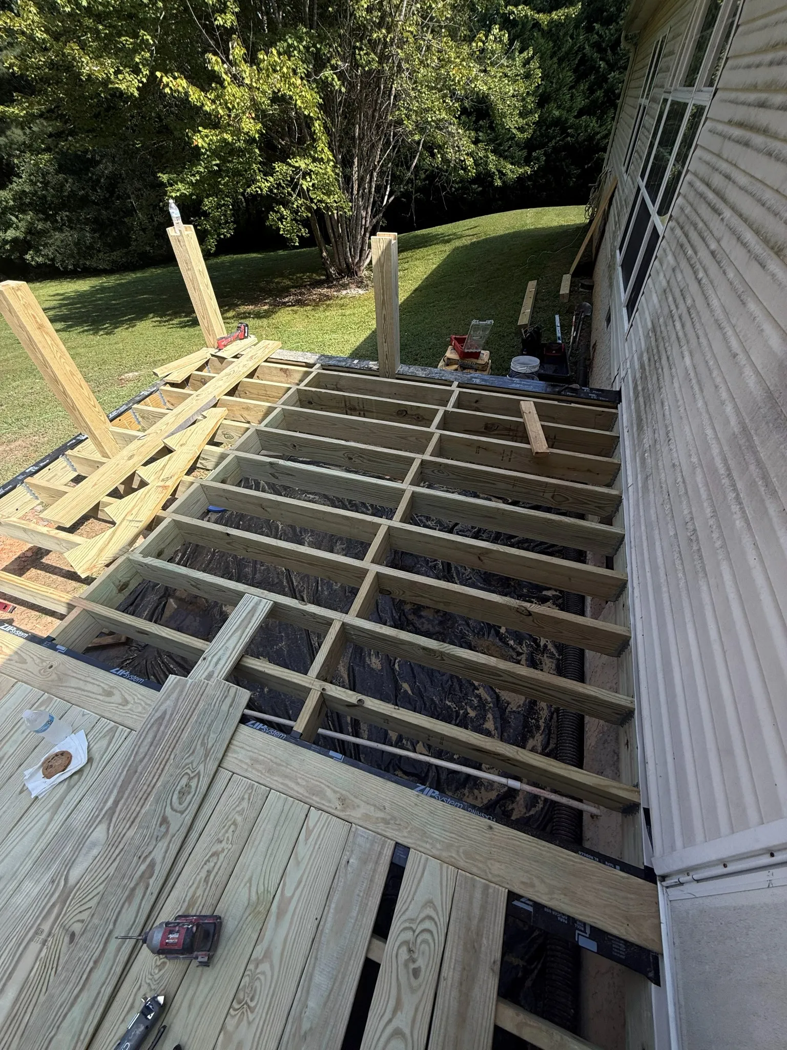 Close detail of deck and porch construction on a Apex project
